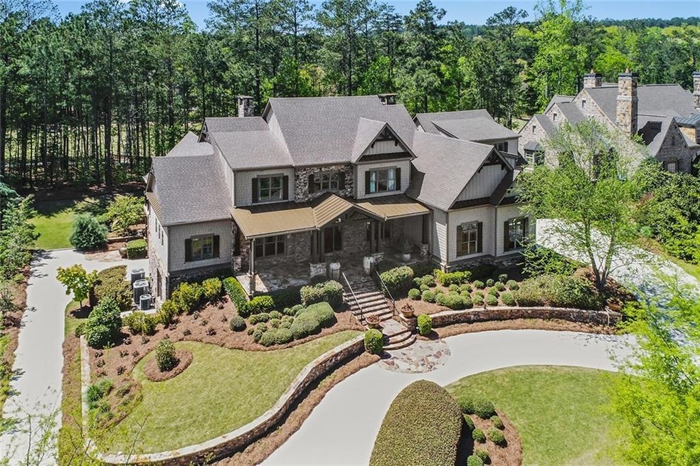 Our aerial view shows the home is backed by an 18 