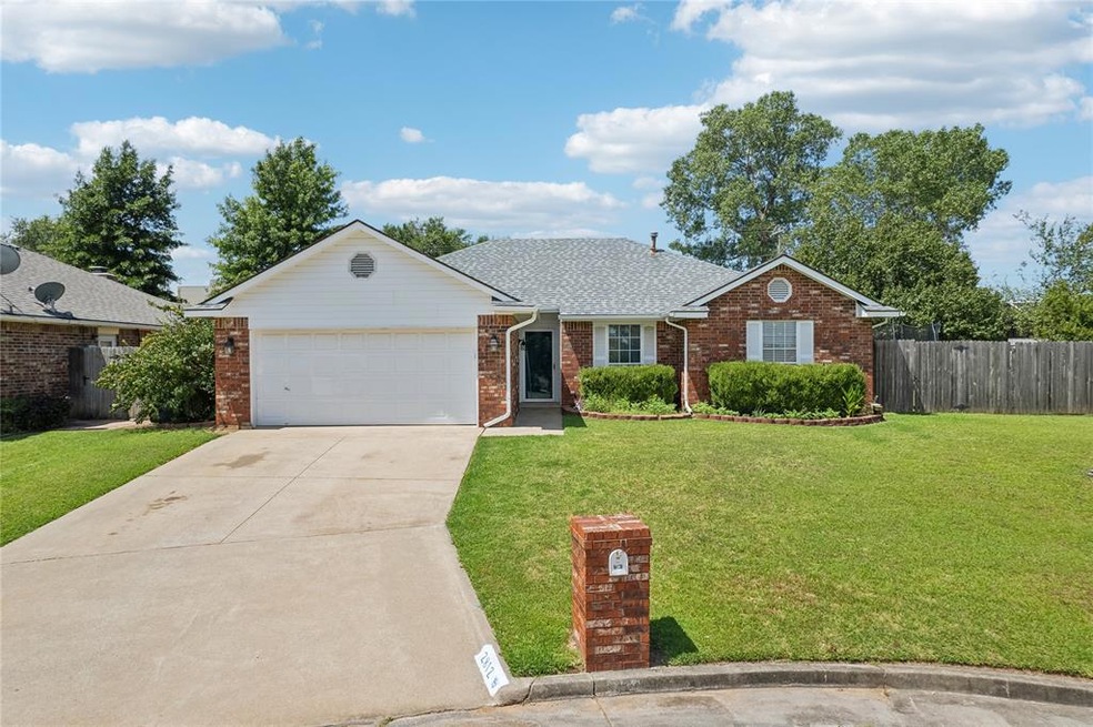 Ranch-style house with a garage and a front yard