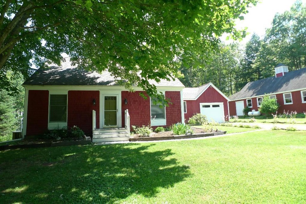 Front of house with attached garage...