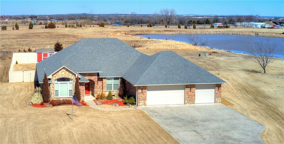 Custom home on .83 acre lot. The pond does not go 
