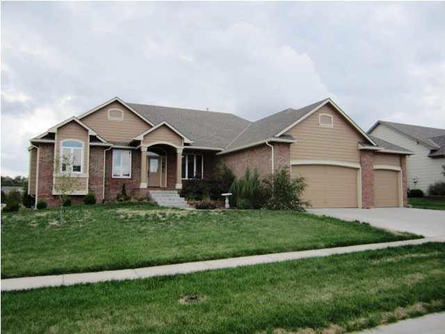 Front of goregeous home with 3 car attached garage