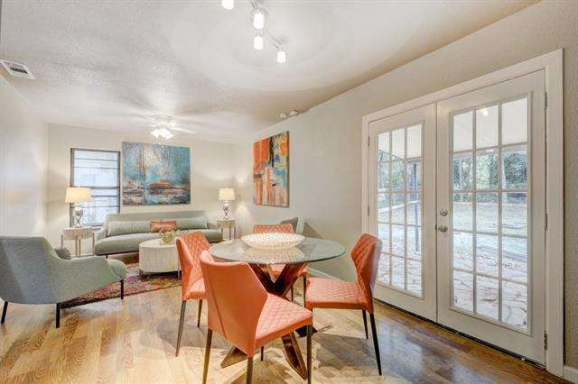 french doors that lead out to the covered flagston