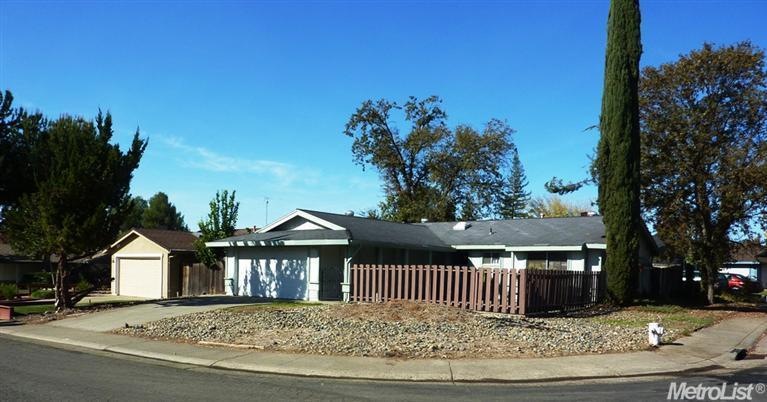 Large corner lot on quiet tree lined street.