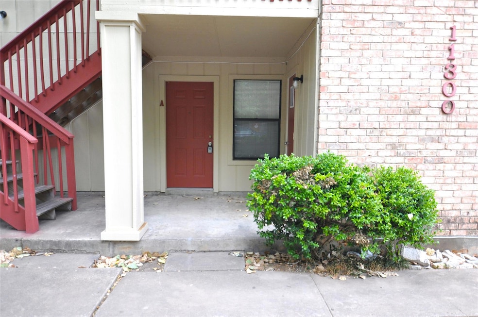 View of exterior entry with board and batten sidi