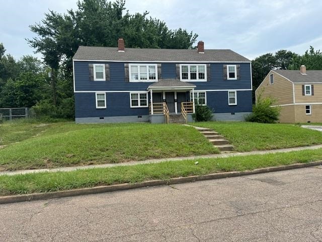 View of front of home featuring a front lawn