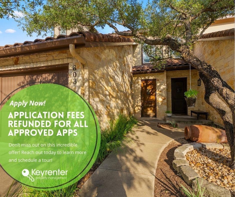 Property entrance featuring a tile roof and stone siding