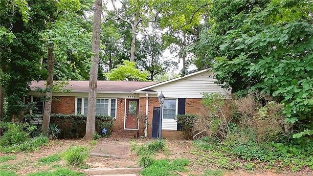 Brick ranch on private wooded lot in convenient lo