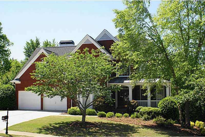 Exterior Front. 3 SIDES BRICK WITH A LARGE LEVEL L