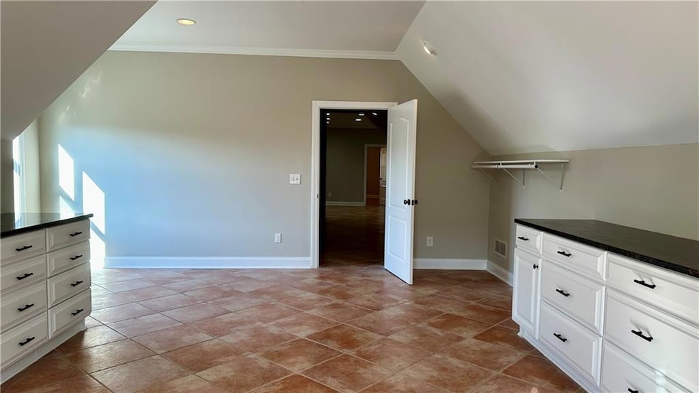 Bonus room featuring recessed lighting, vaulted ceiling, and light tile patterned floors