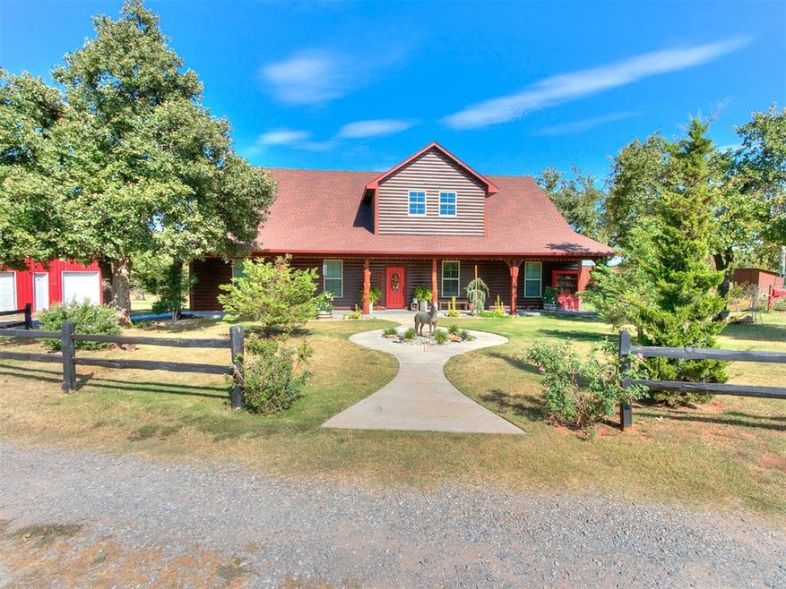 Gorgeous, log sided home with huge front porch and