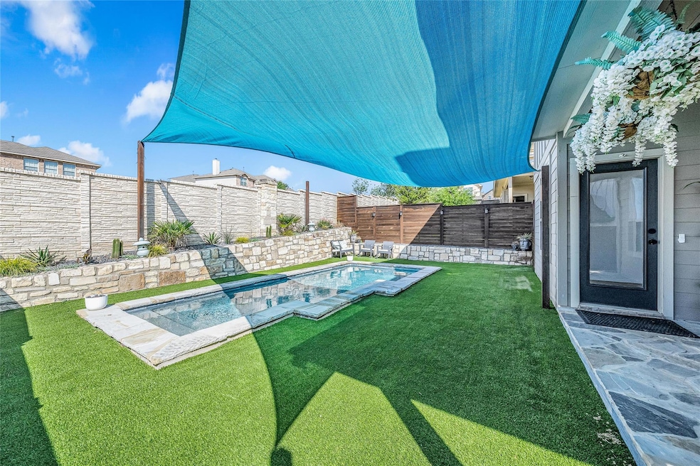 View of yard with a fenced in pool and a fenced b