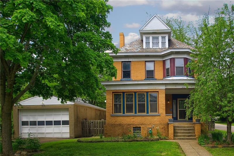 Large brick Victorian with 2 car tandem garage!