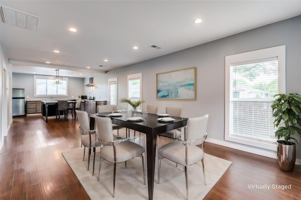 Dining room featuring an inviting chandelier, dark