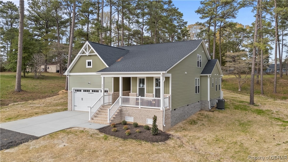 View of front of property with cooling unit, roof