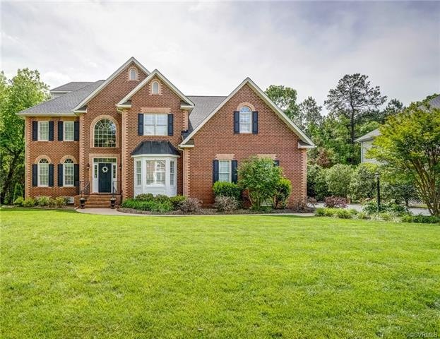Stately brick and vinyl transitional with newly pa