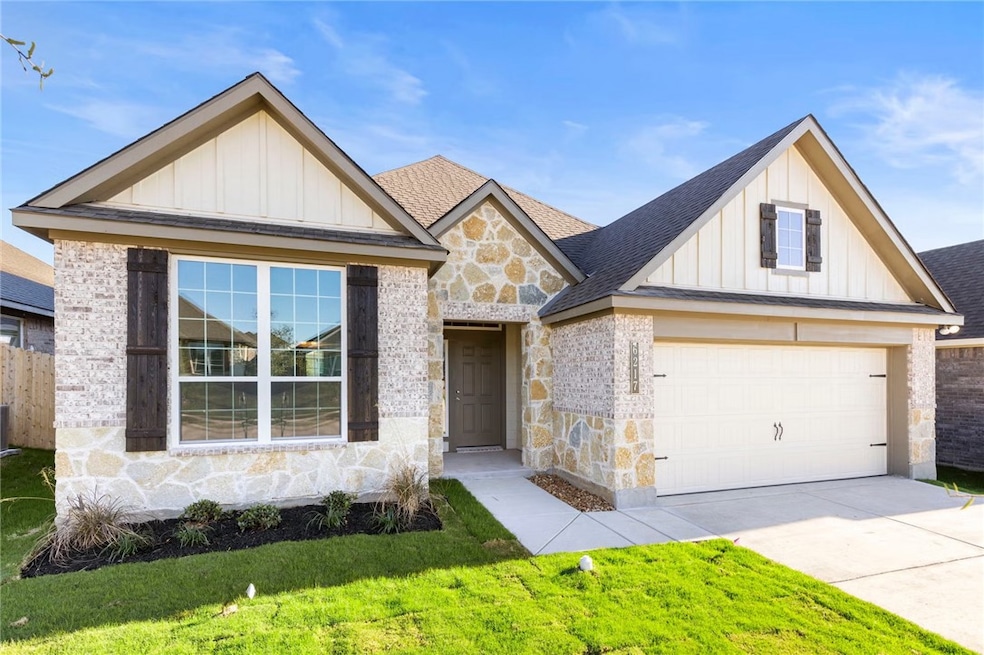 Modern farmhouse with board and batten siding, roof with shingles, stone siding, and a garage