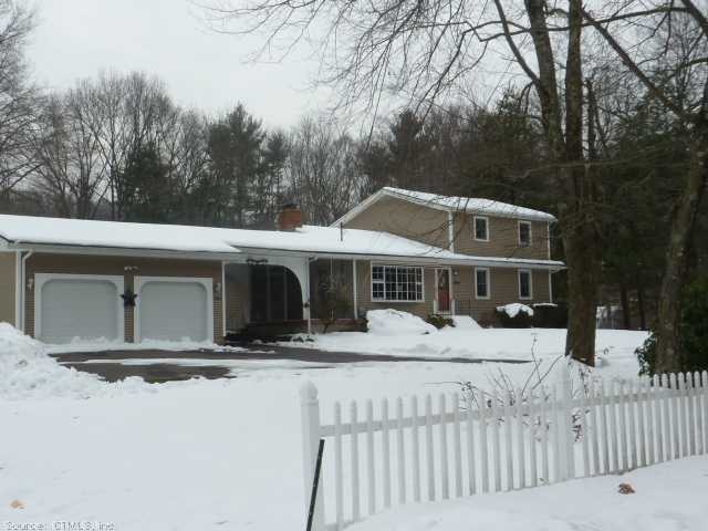 Exterior Front. A white picket fence welcomes you 