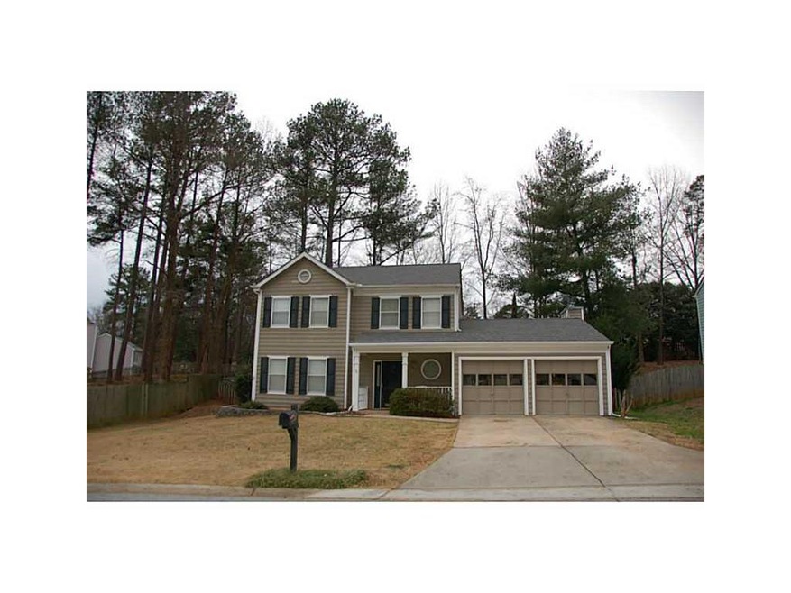 Exterior Front. LONG LEVEL DRIVEWAY