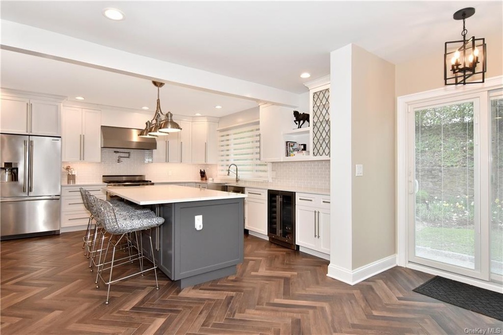 Gorgeous kitchen with quartz counter-tops and slid