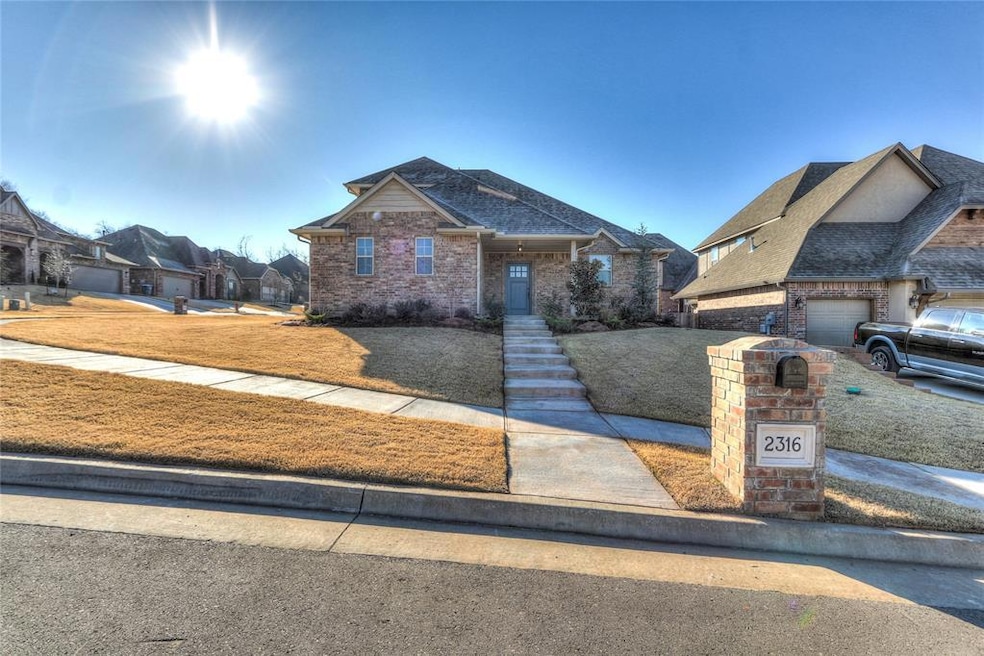 View of front of house with a front yard, roof wit