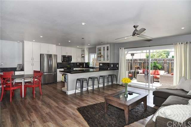 Open living room features recessed LED lighting, 9 ft. slider leading to entertainerâ€™s backyard, custom paint and base boards.