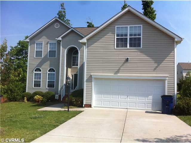 Exterior Front - 2 Car Garage-Paved Driveway-Cover