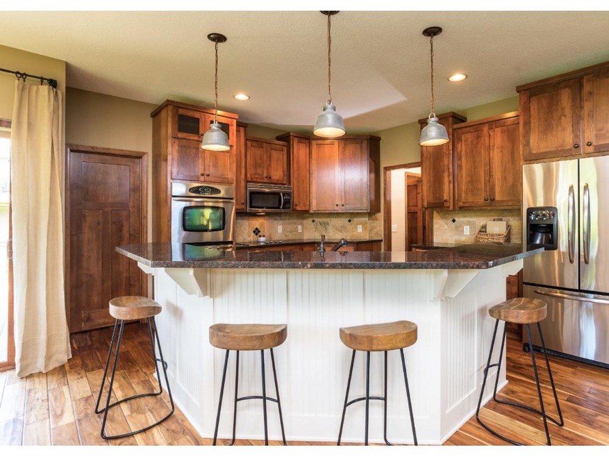 Amazing kitchen features white enameled center isl
