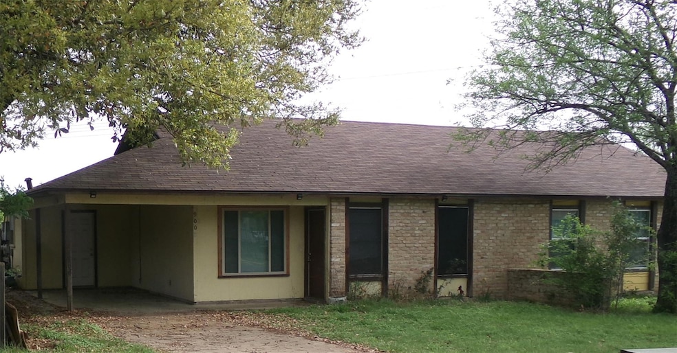 View of front of home featuring a shingled roof, 