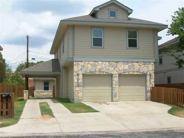 View of front of property with concrete driveway,