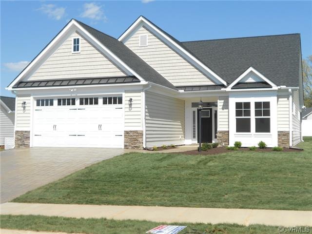 Front of home showing stamped concrete driveway.