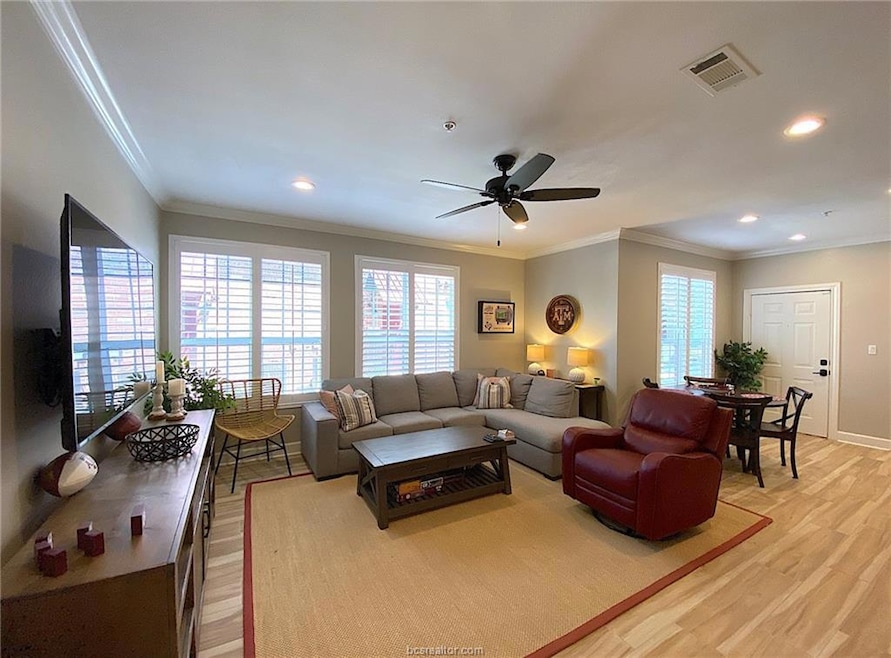 Living area featuring light wood-style floors, a c