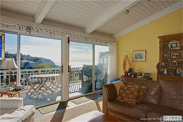 Vaulted open beam ceiling with ocean views in/out.