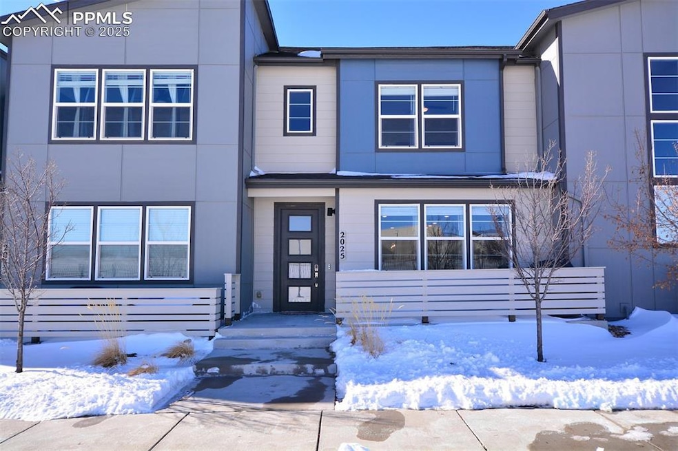 Front view of home with  patio.