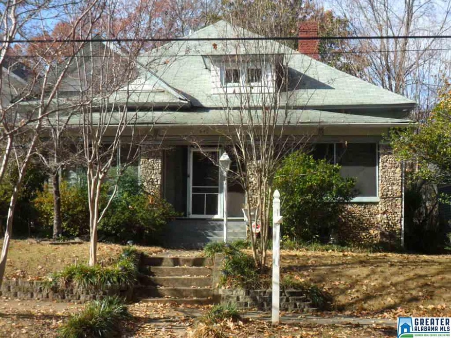 Screened porch across the front of this charming h