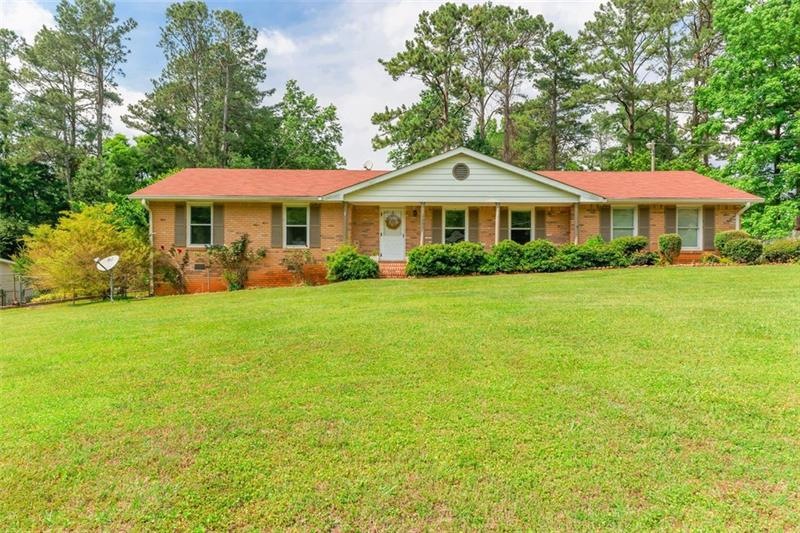 Immaculate brick ranch on beautiful level lot