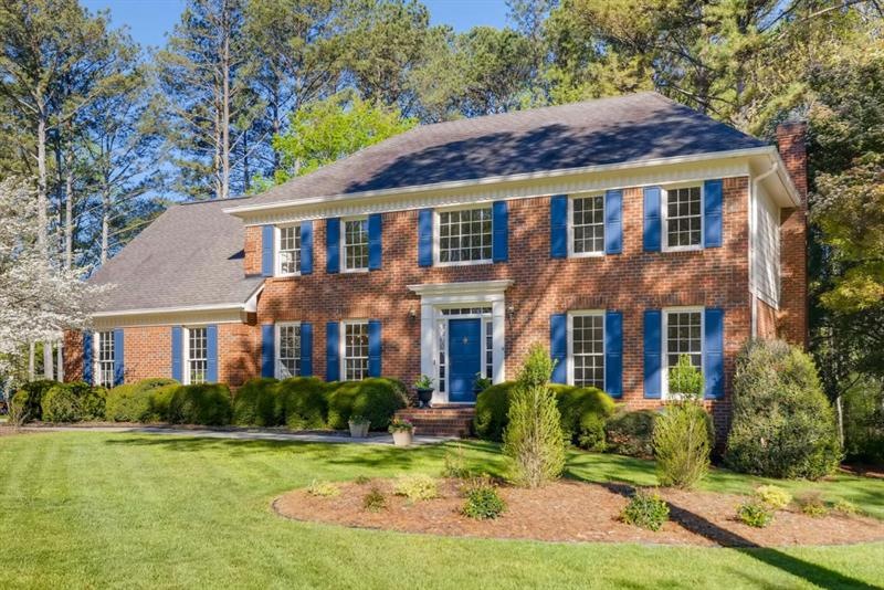 This traditional beauty is situated on a level private wooded 3/4 acre lot.  Welcome Home!