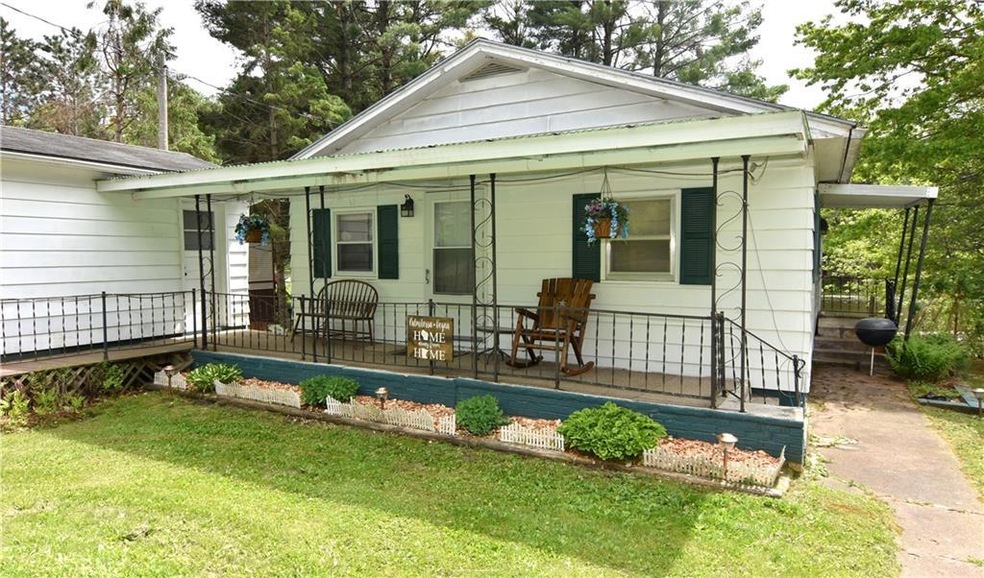 Lakefront property with a shaded front porch to re