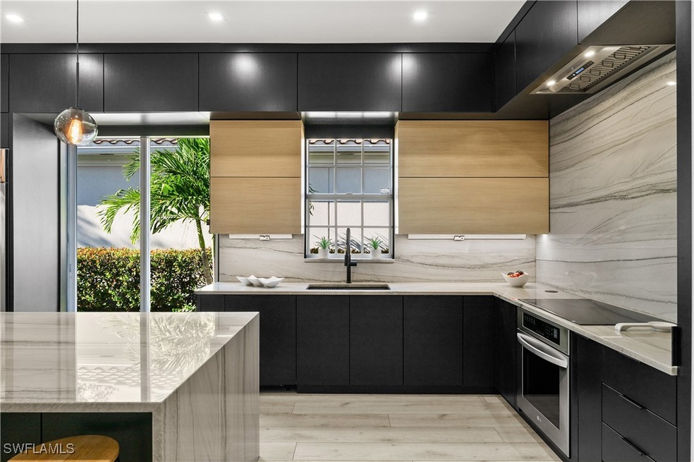 Kitchen with pendant lighting, black electric stov