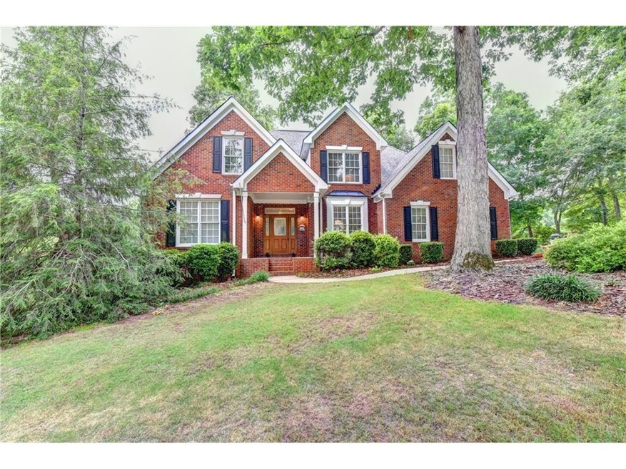 Brick and Cement siding adorn this well built beau