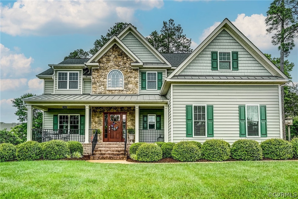 Craftsman-style home with a front yard and a porch