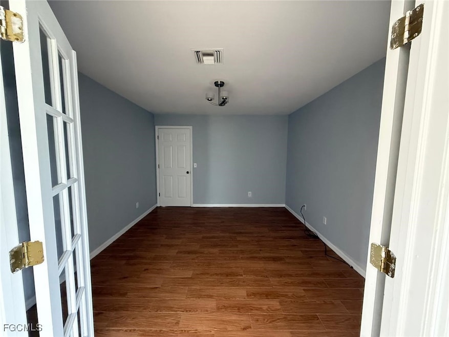 Unfurnished room featuring wood finished floors an