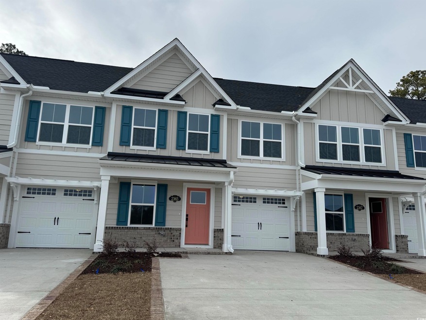 View of front facade featuring a garage