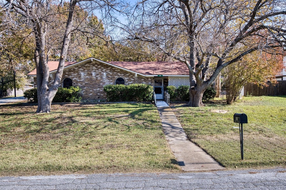 Single story home with a front lawn
