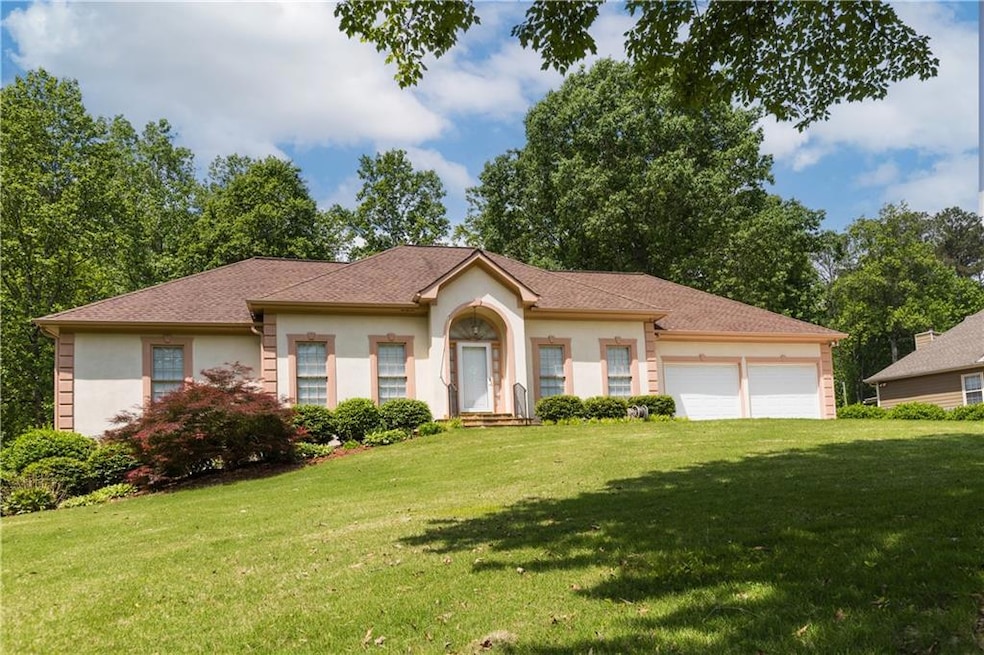 View of front facade featuring an attached garage,