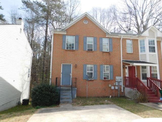 View of front of home featuring brick siding