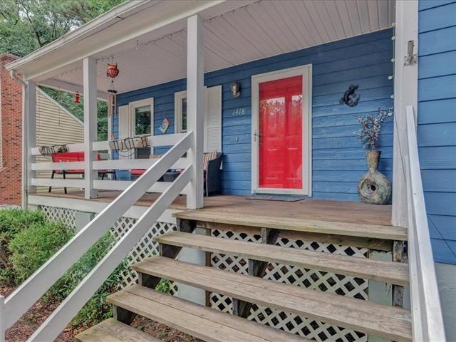 Front Porch with beautiful shutters, new gutters a