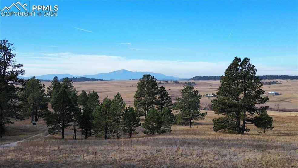View of mountain backdrop featuring rural landscape