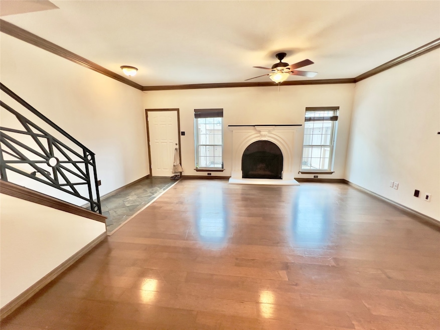 This photo features a spacious, well-lit living ro