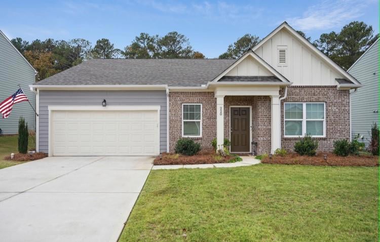View of front of house featuring a garage and a fr