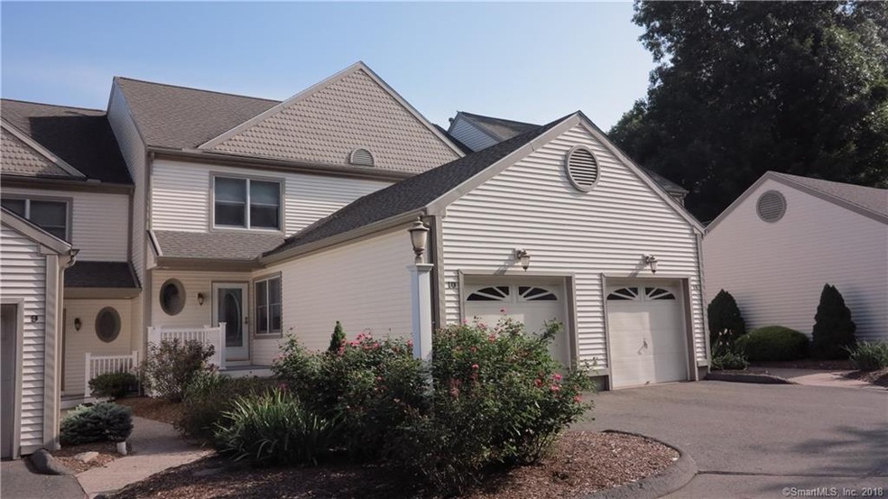 Front of condo with attached garage